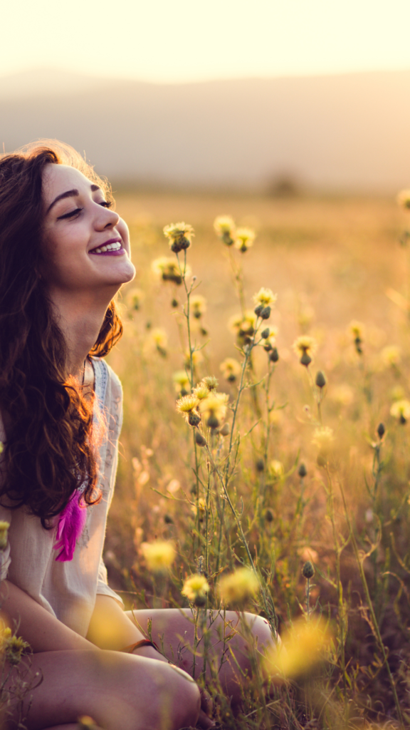 Girl Smile in Yellow Flower Garden Wallpaper